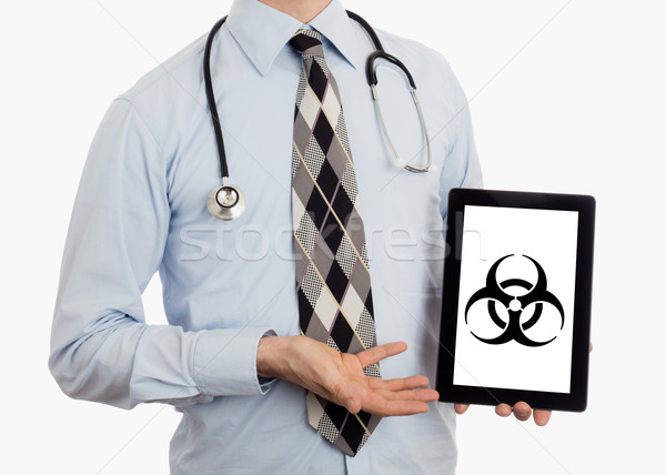 Stock photo: Doctor holding tablet - Warning! Biohazard!