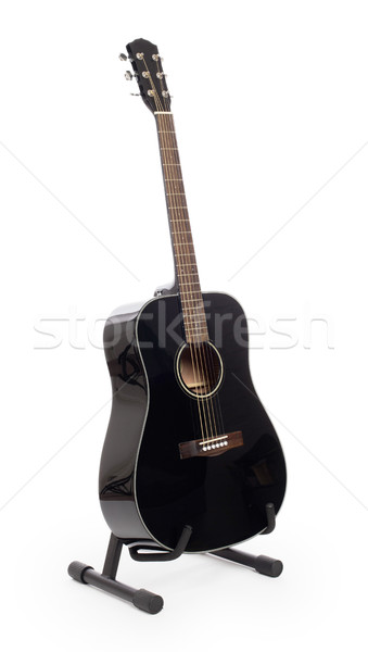 Black acoustic guitar on stand, isolated Stock photo © michaklootwijk