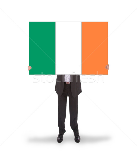 Smiling businessman holding a big card, flag of Ireland Stock photo © michaklootwijk