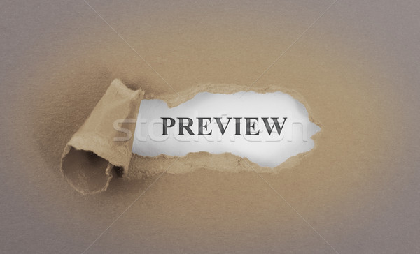 Stock photo: Text appearing behind torn brown envelop