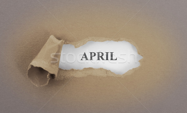 Text appearing behind torn brown envelop Stock photo © michaklootwijk