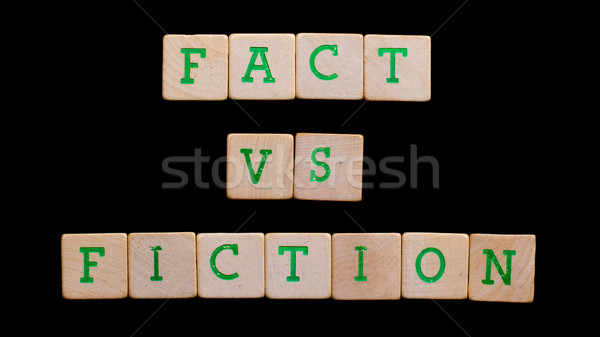 Letters on old wooden blocks (fact, fiction) Stock photo © michaklootwijk