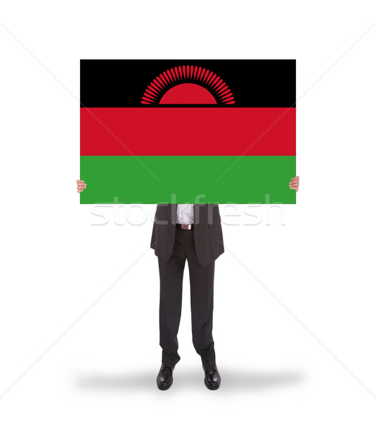 Businessman holding a big card, flag of Malawi Stock photo © michaklootwijk