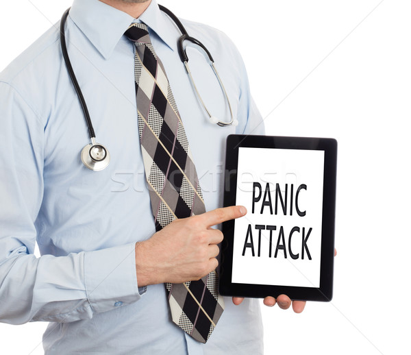 Doctor holding tablet - Panic attack Stock photo © michaklootwijk