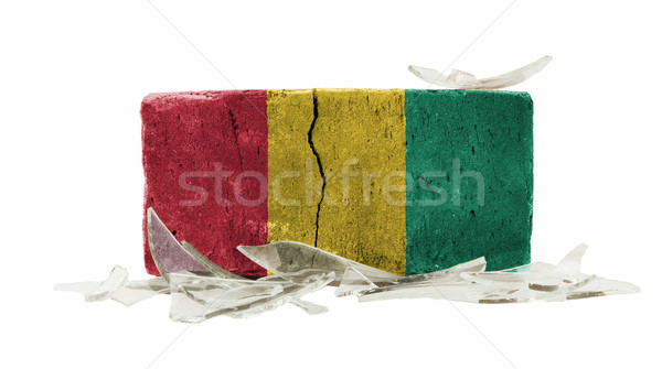 Tijolo cacos de vidro violência bandeira Guiné parede Foto stock © michaklootwijk