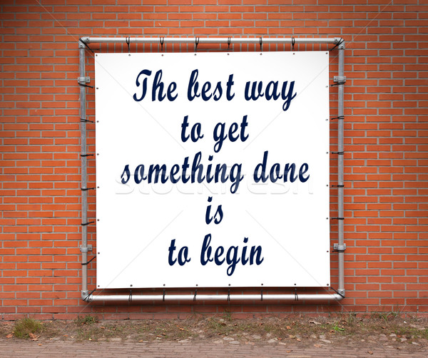 Large banner with inspirational quote on a brick wall Stock photo © michaklootwijk