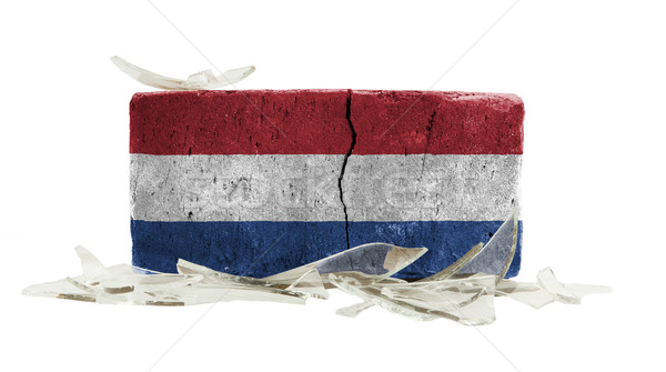 Foto stock: Ladrillo · vidrios · rotos · violencia · bandera · Países · Bajos · pared
