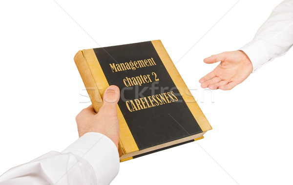 Businessman giving an used book to another businessman Stock photo © michaklootwijk