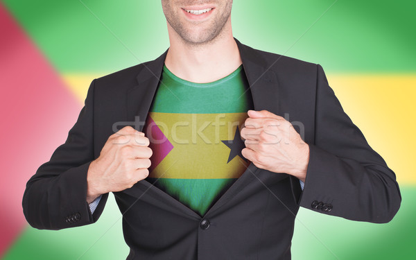 Businessman opening suit to reveal shirt with flag Stock photo © michaklootwijk