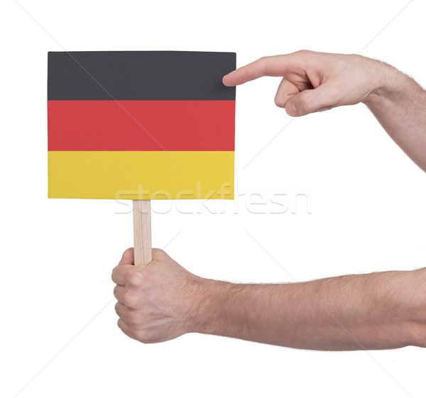 Kéz tart kicsi kártya zászló Németország Stock fotó © michaklootwijk