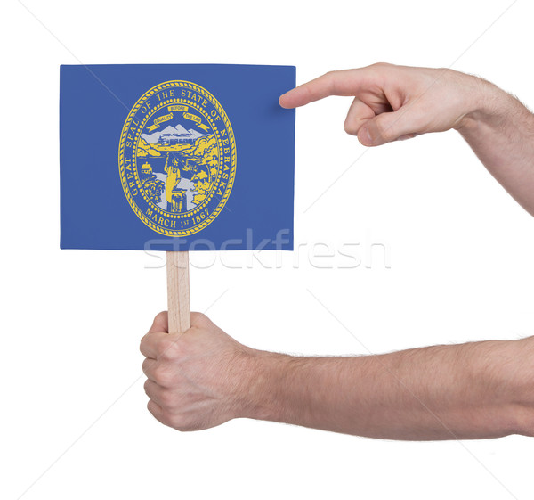 Kéz tart kicsi kártya zászló Nebraska Stock fotó © michaklootwijk