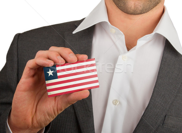 Businessman is holding a business card, Liberia Stock photo © michaklootwijk