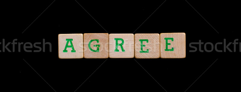 Letters on old wooden blocks (agree) Stock photo © michaklootwijk