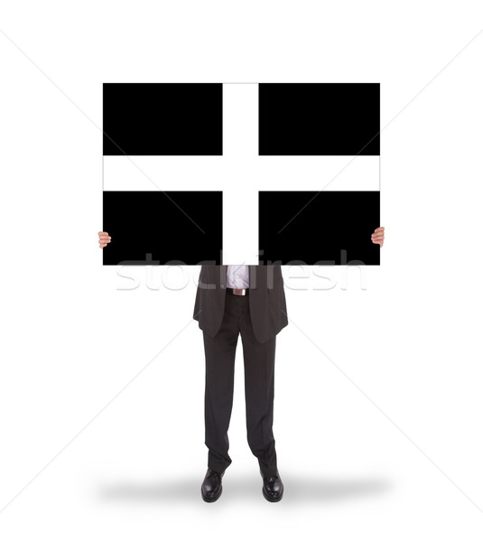 Smiling businessman holding a big card, flag of Cornwall Stock photo © michaklootwijk