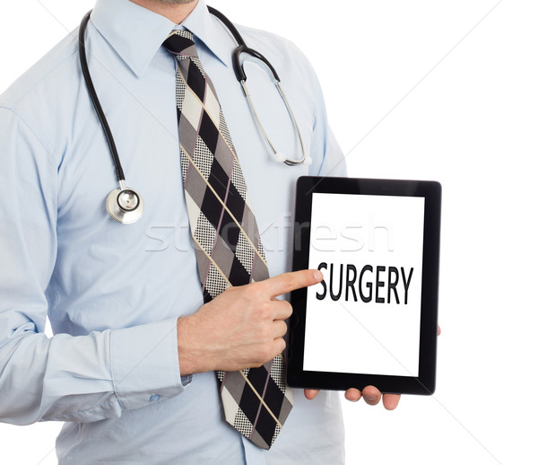 Arzt halten Tablet Chirurgie isoliert weiß Stock foto © michaklootwijk