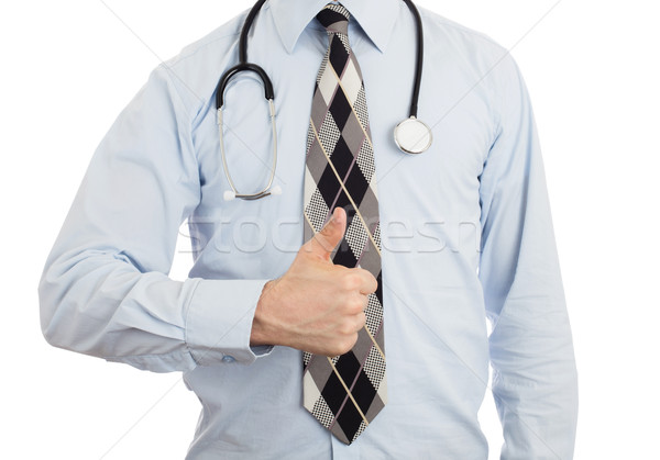 Male doctor showing thumbs up Stock photo © michaklootwijk