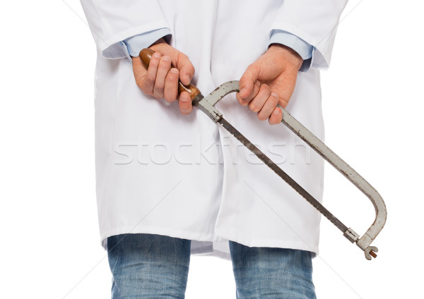 Crazy doctor is holding a big saw in his hands Stock photo © michaklootwijk