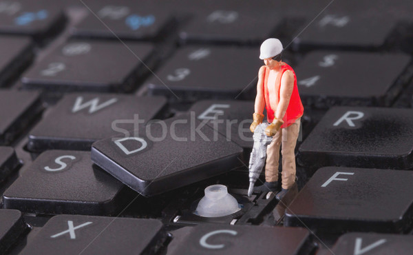 Miniature worker with drill working on keyboard Stock photo © michaklootwijk