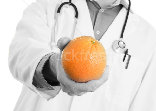 Nutritionist doctor, giving an orange, isolated Stock photo © michaklootwijk