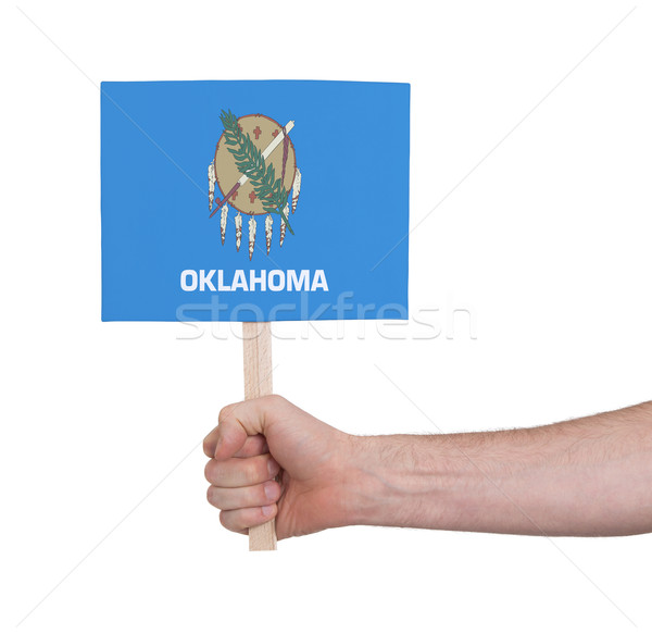 Hand holding small card - Flag of Oklahoma Stock photo © michaklootwijk