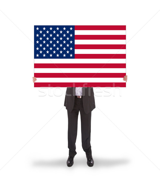 Smiling businessman holding a big card, flag of the United State Stock photo © michaklootwijk