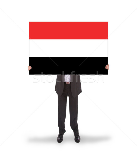 Businessman holding a big card, flag of Yemen Stock photo © michaklootwijk