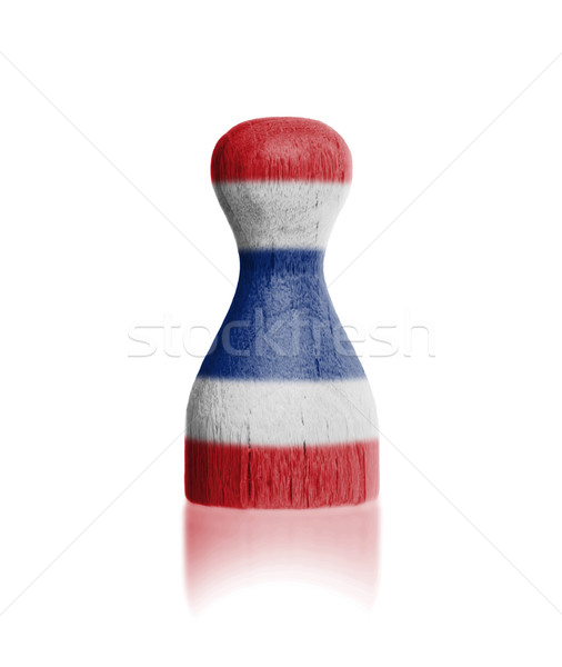 Wooden pawn with a painting of a flag Stock photo © michaklootwijk