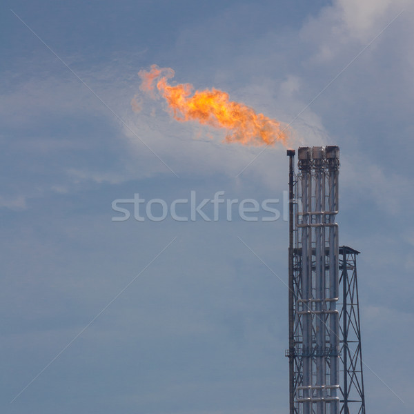 Brûlant pétrolières gaz flare coucher du soleil rotterdam Photo stock © michaklootwijk