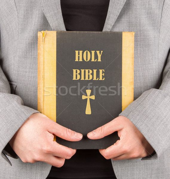 Woman in business suit is holding a holy bible Stock photo © michaklootwijk