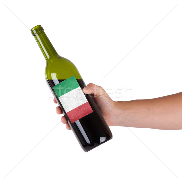 [[stock_photo]]: Main · bouteille · vin · rouge · étiquette · Italie