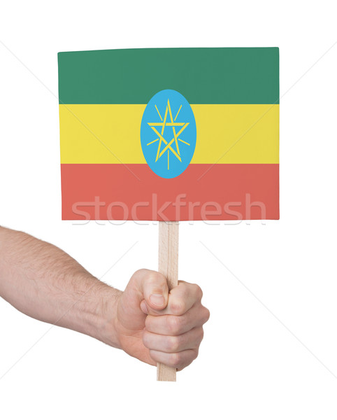 Kéz tart kicsi kártya zászló Etiópia Stock fotó © michaklootwijk