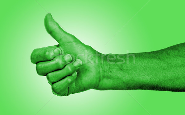 Stock photo: Old woman with arthritis giving the thumbs up sign