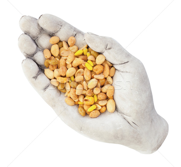 Fresh mixed salted nuts in a bowl (hand), peanut mix Stock photo © michaklootwijk