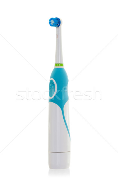 Eléctrica cepillo de dientes aislado blanco fondo azul Foto stock © michaklootwijk