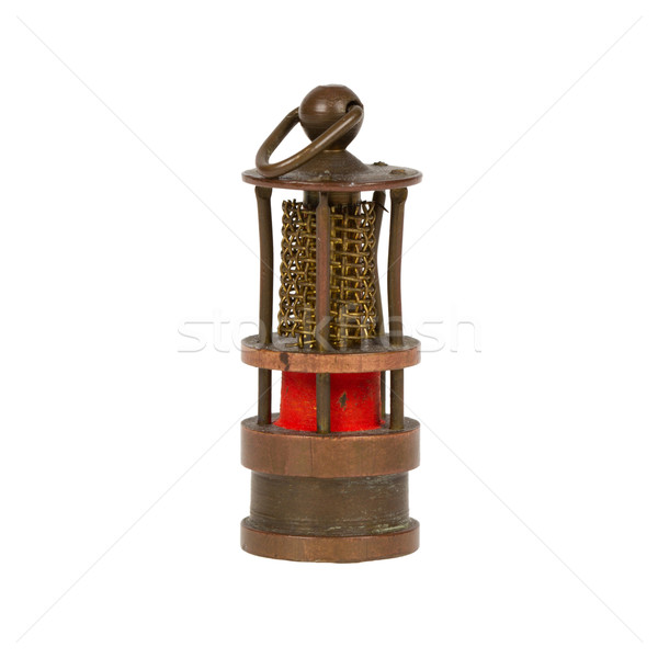 Very old miniature of a miners lamp, isolated on white Stock photo © michaklootwijk
