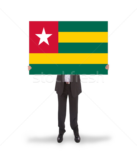Businessman holding a big card, flag of Togo Stock photo © michaklootwijk