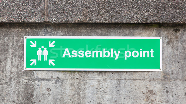 Green plastic 'assembly point' sign Stock photo © michaklootwijk