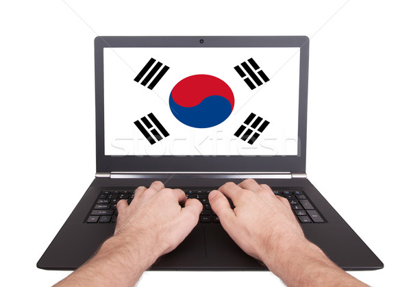 Mani lavoro laptop Corea del Sud schermo Foto d'archivio © michaklootwijk