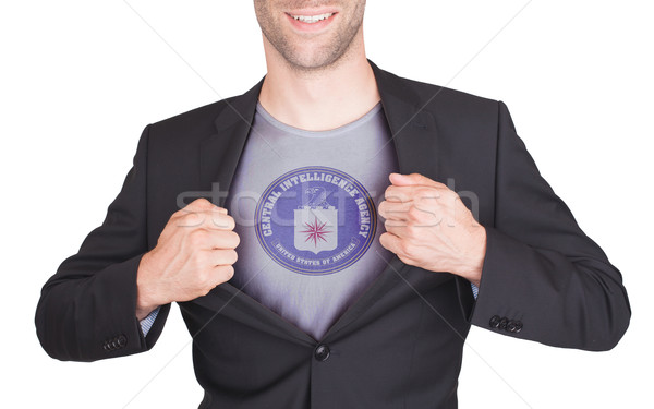 Businessman opening suit to reveal shirt with flag Stock photo © michaklootwijk