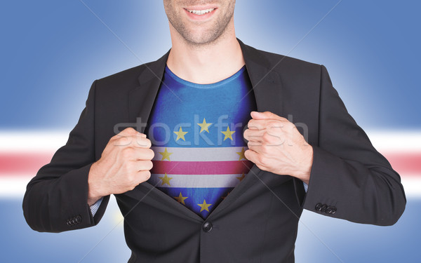 Businessman opening suit to reveal shirt with flag Stock photo © michaklootwijk