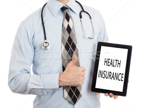 Doctor holding tablet - Health insurance Stock photo © michaklootwijk