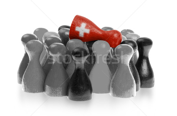 Stock photo: One unique pawn on top of common pawns