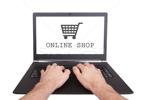 Man working on laptop, online shop Stock photo © michaklootwijk