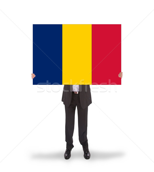 Businessman holding a big card, flag of Romania Stock photo © michaklootwijk
