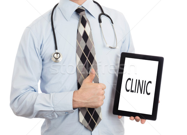 Stock photo: Doctor holding tablet - Clinic