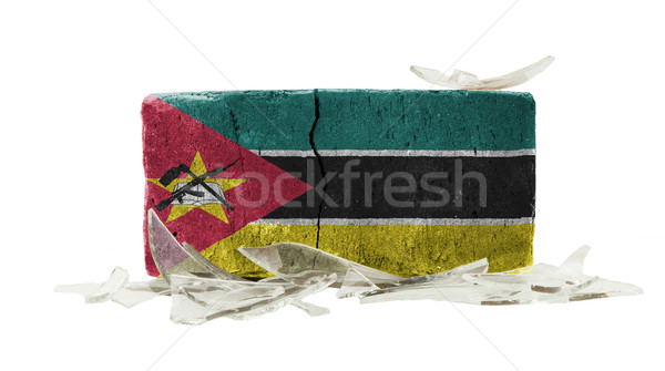 Tijolo cacos de vidro violência bandeira Moçambique parede Foto stock © michaklootwijk