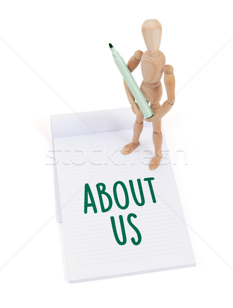 Wooden mannequin writing - About us Stock photo © michaklootwijk