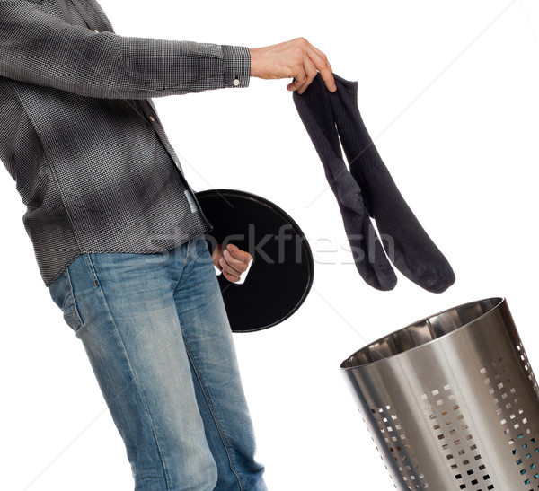 Junger Mann schmutzigen Socken Wäschekorb isoliert weiß Stock foto © michaklootwijk