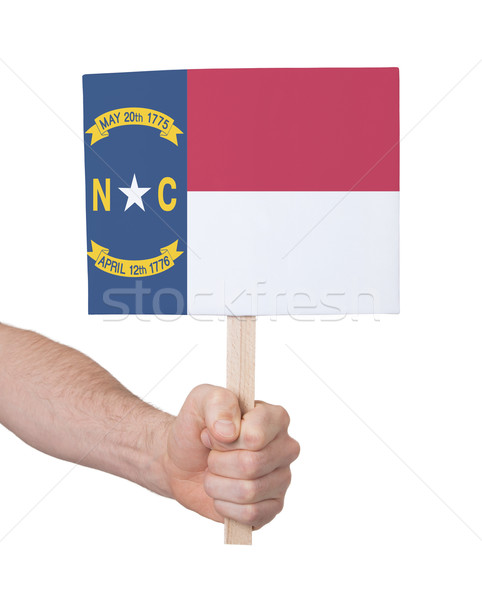 Kéz tart kicsi kártya zászló Észak-Karolina Stock fotó © michaklootwijk