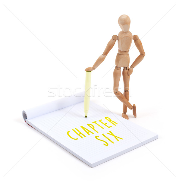 Wooden mannequin writing - Chapter six Stock photo © michaklootwijk